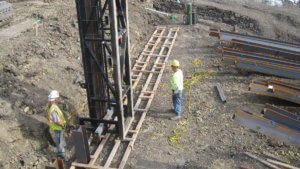 Herberger Construction team members undergo construction work on the Massena sliding bridge project.