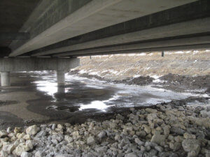 Beneath the DSM River bridge by Herberger Construction.
