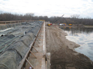 A view showing the dammed area below the construction of the new bridge.