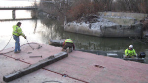 Herberger crews work on the demolition of an Ottumwa bridge.