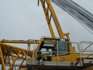 Side view of a Herberger yellow crane.