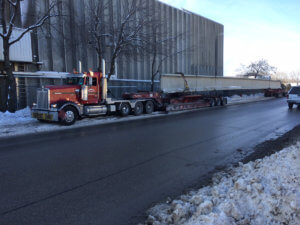 A truck carries a beam for the Middle River bridge.