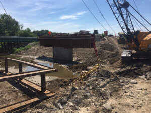 Bridge supports are constructed over the Bear Creek.