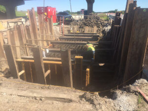 Crew members lay foundations for a bridge in Warren County.