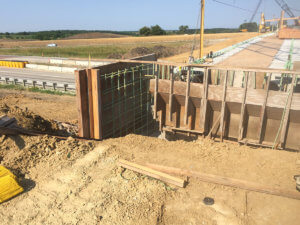 Construction crews span the gap over a Warren County highway.
