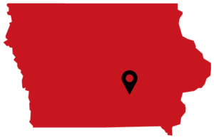 A red icon of Iowa with a location pin on Indianola.